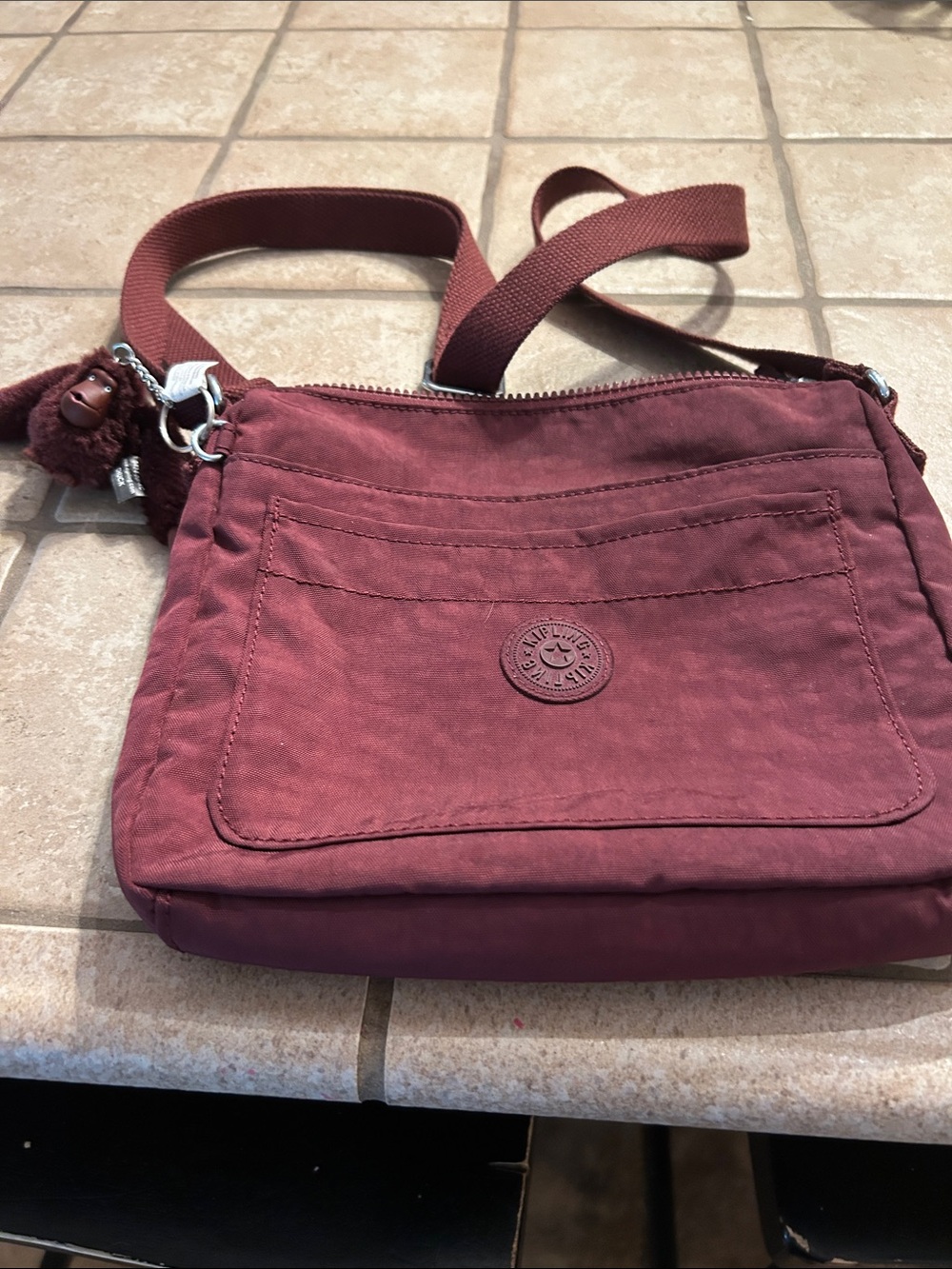 Kipling Burgundy Crossbody Bag with Front Pocket